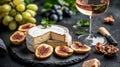 Brie Cheese, Figs, Walnuts, and a Glass of Rose Wine Royalty Free Stock Photo