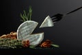 Brie cheese and fork with triangle piece Royalty Free Stock Photo