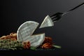 Brie cheese and fork with triangle piece Royalty Free Stock Photo