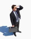 Briefcase, thinking and young businessman with brainstorming and wonder expression by white background. Idea, bag and Royalty Free Stock Photo