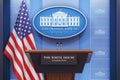 Briefing of president of US United States in White House. Podium speaker tribune with USA flags and sign of White House. Politics Royalty Free Stock Photo