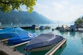 Brienz harbor with moored boats, lime tree branch. landscape switzerland Royalty Free Stock Photo