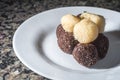 brigadeiro and beijinho, Brazilian sweets on a white plate, selective focus and copy space