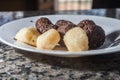 brigadeiro and beijinho, Brazilian sweets on a white plate, selective focus and copy space