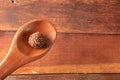 Brigadeiro in wooden spoon on wooden background Royalty Free Stock Photo