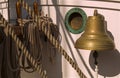 Vintage sailboat`s bell, porthole and rope lines