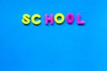 Brigh blue backgroun with the inscription school on trendy neon background