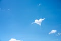 Brigh blue sky background with white clouds in heart shaped and copy space