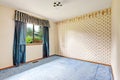 Brigh empty room with blue curtains and carpet floor Royalty Free Stock Photo