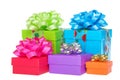 Brighly colored presents with bows isolated on white