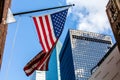 Bright american flag and the skyscrappers in a sunny weather