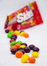 Skittles. Bright and appetizing candies - skittles. Openned pack with skittles in it Royalty Free Stock Photo