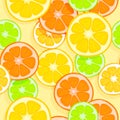 Bright appetizing seamless tropical background. Oranges, lemons, limes and grapefruits. Slices of tropical fruits on a light