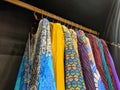 Bright Arabic dresses hang in a row on hangers in the store. Dubai, UAE Royalty Free Stock Photo