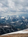 Bright atmospheric scenery on top of mountain ridge above clouds in thick low clouds. Beautiful landscape with spotted mountain Royalty Free Stock Photo