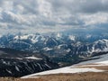 Bright atmospheric scenery on top of mountain ridge above clouds in thick low clouds. Beautiful landscape with spotted mountain Royalty Free Stock Photo