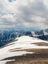 Bright atmospheric scenery on top of mountain ridge above clouds in thick low clouds. Beautiful landscape with spotted mountain Royalty Free Stock Photo