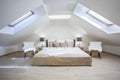 Bright attic bedroom in the apartment Royalty Free Stock Photo