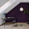 Attic home office room with violet wall Royalty Free Stock Photo