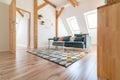 Bright attic living room with textile sofa