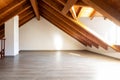 Bright attic with wooden beams and parquet