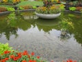 Bright attractive fresh serene pool and colorful flowerbed in bloom close up 2020 Royalty Free Stock Photo