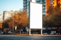 Bright autumn day, blank vertical outdoor billboard mockup on city street Royalty Free Stock Photo