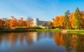 Bright autumn landscape with State Museum Reserve Gatchina. Sunny panoramic autumn view of the park, Karpin Pond and Great Palace Royalty Free Stock Photo