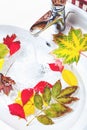 Bright autumn leaves floating in trendy white sink