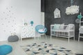 Bright baby bedroom with cot