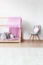 Bright baby`s bedroom with chair