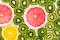 Bright background with kiwi fruit, grapefruit and oranges Royalty Free Stock Photo