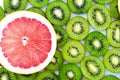 Bright background with kiwi fruit, grapefruit and oranges Royalty Free Stock Photo