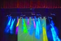 Bright background with light equipment and color rays of light. Light show design.