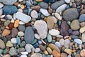 Bright background of multi-colored round stones, sea pebbles Royalty Free Stock Photo