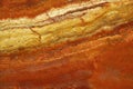 Bright background of natural stone in the colors of lush lava called Travertin Rosso