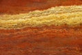 Bright background of natural stone in the colors of lush lava with a white stripe called Travertin Rosso