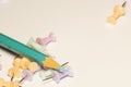 Bright background with pencil and push pins in delicate colors Royalty Free Stock Photo