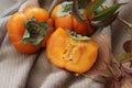 bright background. ripe orange persimmon on a beige background. beautiful background texture. juicy fruits. vitamins