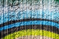 Bright background of a wall of sprayed, textured concrete pavement with multi-colored arcuate stripes Royalty Free Stock Photo