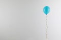 Bright balloon on light background. Celebration time