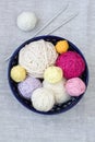 Bright balls of yarn and knitting needles