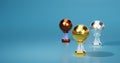 Bright Basketball Gold Silver and Bronze Trophies Focused on Gold with a soft light background Royalty Free Stock Photo