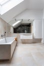 Bright bathroom with huge bath