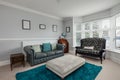 Bright bay fronted blue and white living room