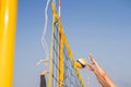 Bright beach scene with a net and volley ball at sunset Royalty Free Stock Photo