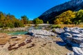 Bright Beautiful Fall Foliage on the Crystal Clear Frio River in Texas. Royalty Free Stock Photo