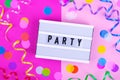 Bright long confetti and white Party text