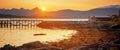 Bright beautiful orange sunset on the Norwegian Sea, Tromso Norway. Midnight sun, panorama banner format Royalty Free Stock Photo