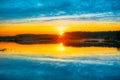 Bright beautiful Sunrise over Calm Lake, River and Royalty Free Stock Photo